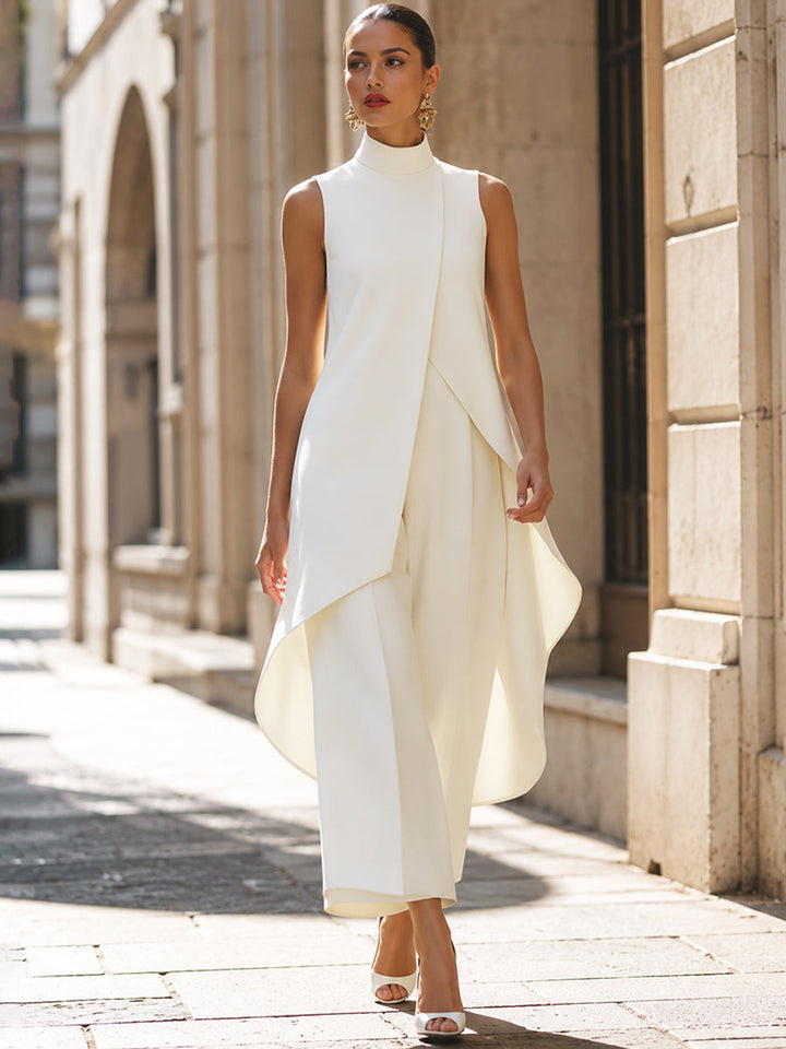 Women's Two-Piece Asymmetric Top and Wide-Leg Pants Set in cream, walking on a stone street.
