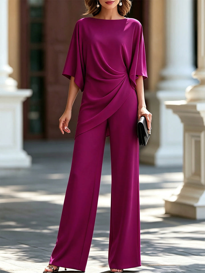 Model wearing the set in vivid magenta, showing the gathered side drape on the top and wide-leg pants. 4