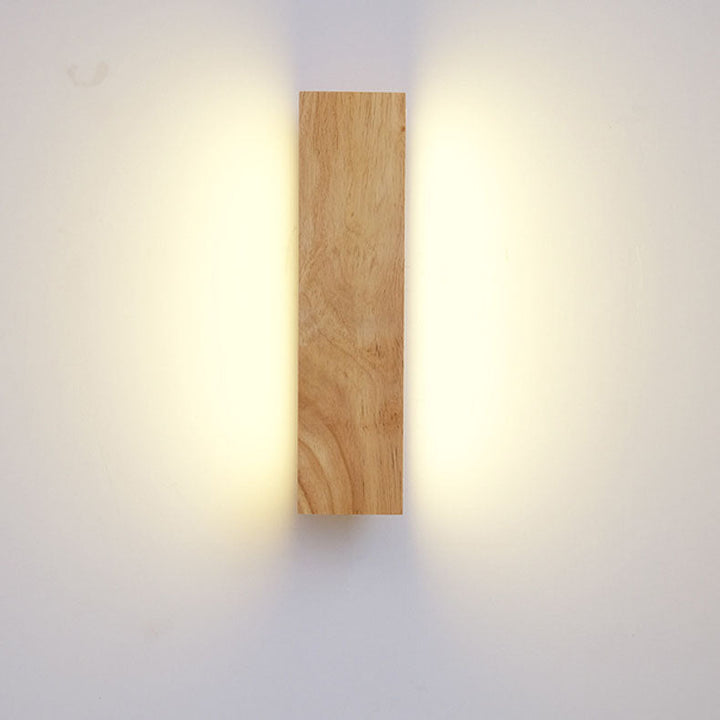Beige and white Japanese-style LED wall light, another view, shown front on with warm light.