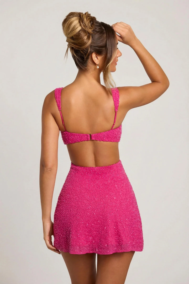 Pink embellished mini dress, back detail with open back and clasp.