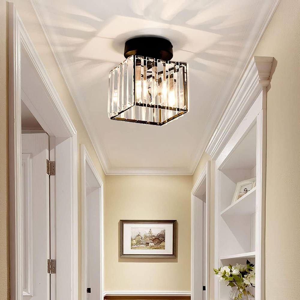Black square ceiling light detail above a white-trimmed hallway.