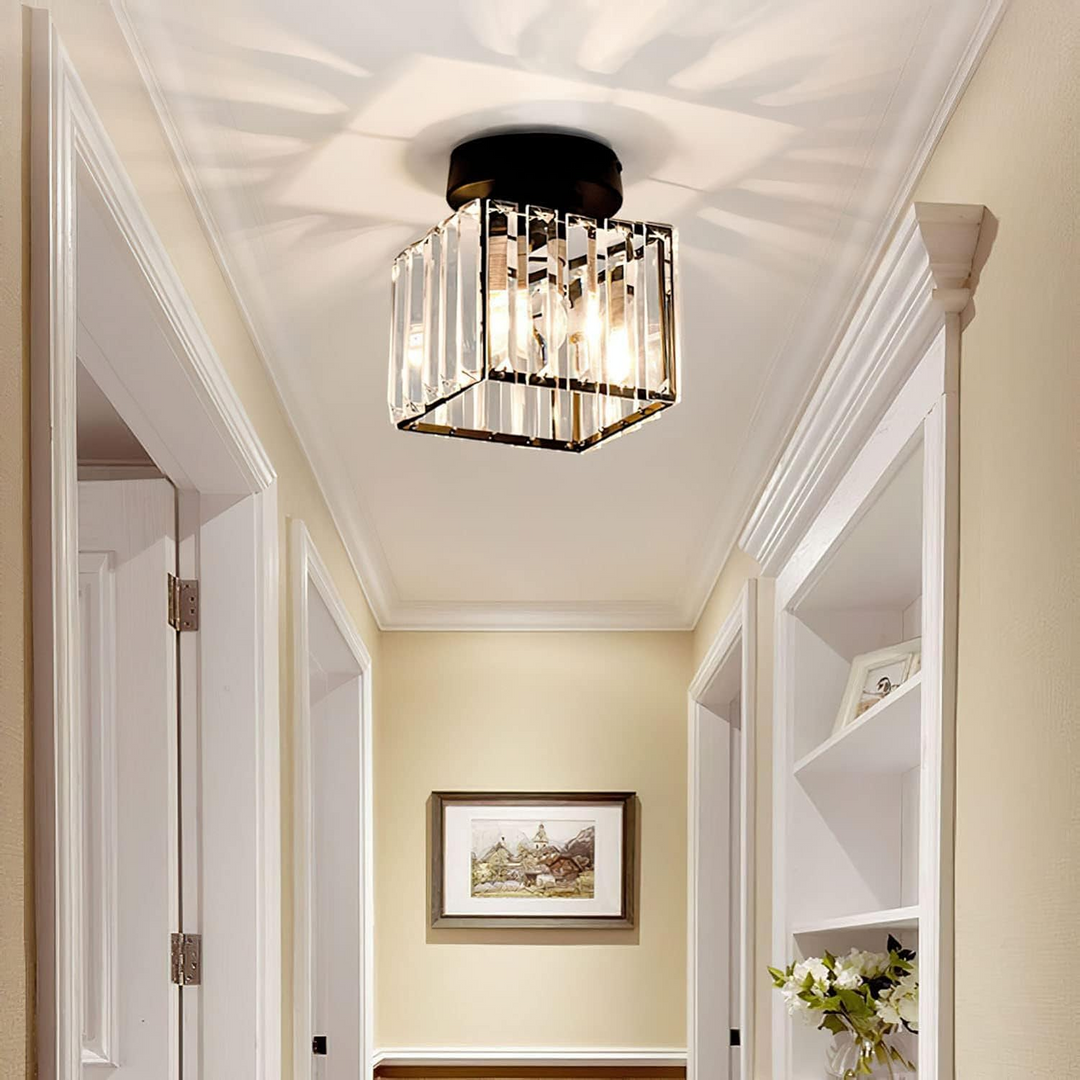 Black square ceiling light detail above a white-trimmed hallway.