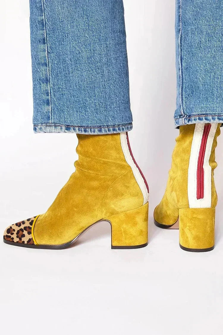 Mustard yellow leather heeled boots with leopard-print toe caps, another view.