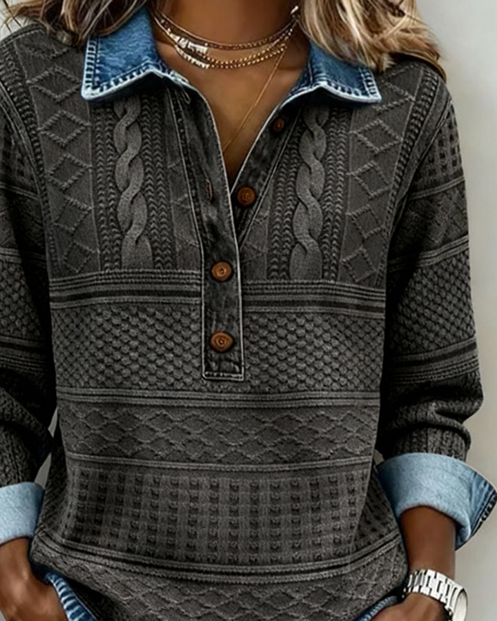 Women's charcoal gray patterned sweatshirt detail with collar, buttons, and rolled cuff.