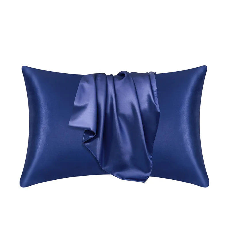 Deep navy blue pillowcase made of 100% mulberry silk on a plain white background.