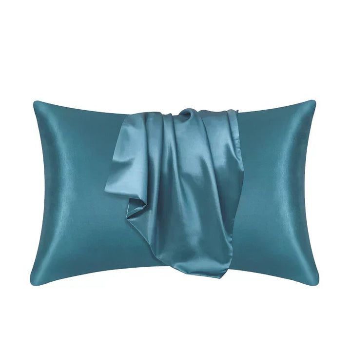 Teal blue-green pillowcase made of 100% mulberry silk on a plain white background.