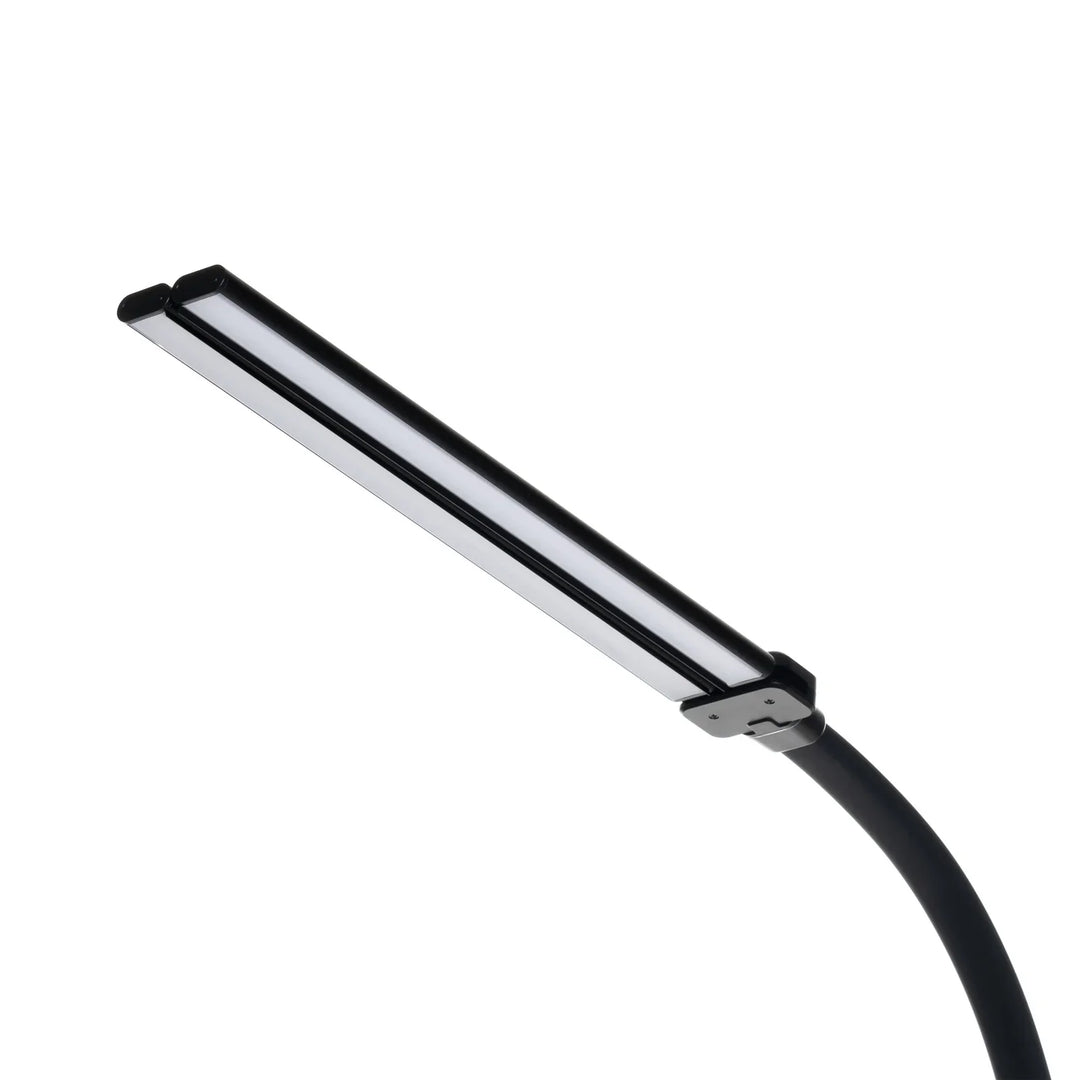 Black desk lamp detail showing the flat double-strip light bar on a curved neck.