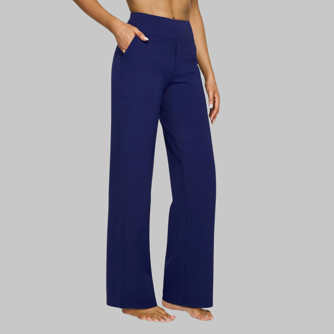 Women's navy blue high-waist straight-leg pants on a model, side view with a hand in the side pocket.