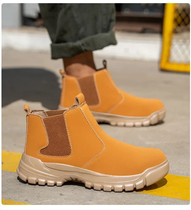 Tan boot with brown elastic side panel and contrast stitching, worn on a yellow-striped floor 10