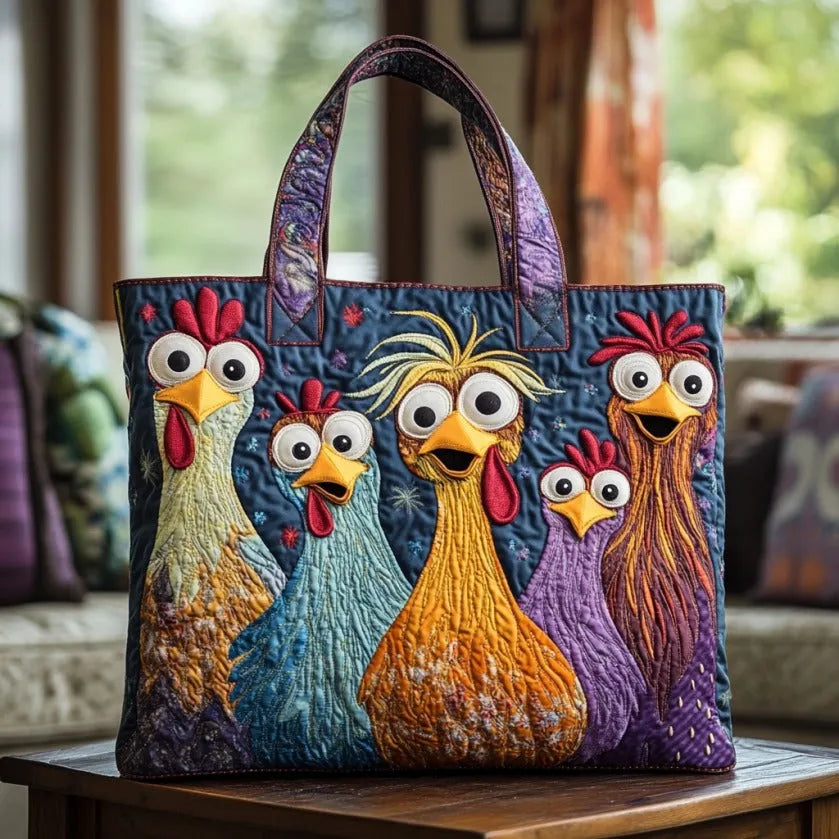 Blue quilted tote with five colorful appliqué chickens and big googly eyes on a wooden table.