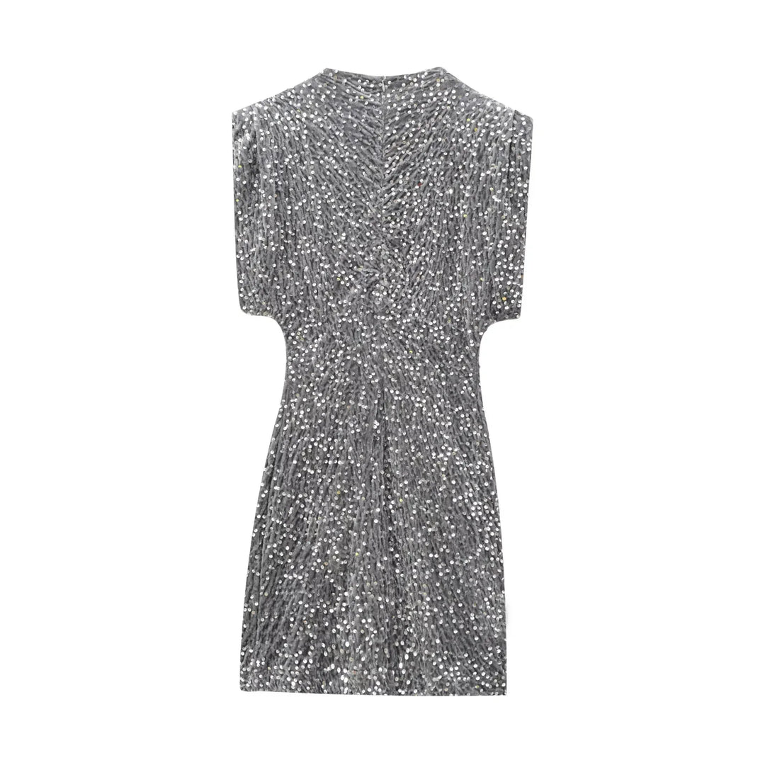 Back view of gray sequined mini dress laid flat, showing gathered center seam 10