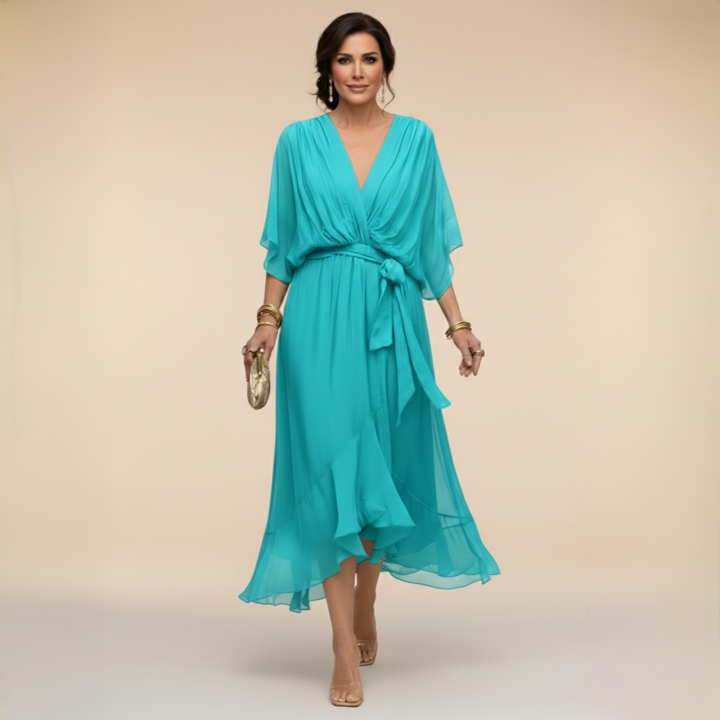 Bright turquoise midi dress another view with a gathered wrap bodice and side waist tie.
