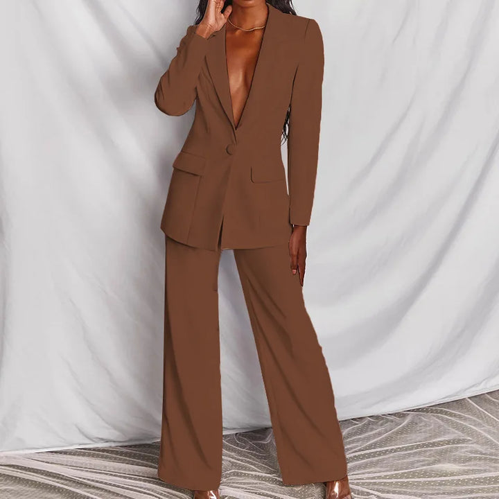 Front view of the brown suit with flap pockets and wide-leg pants, worn with clear heels 10