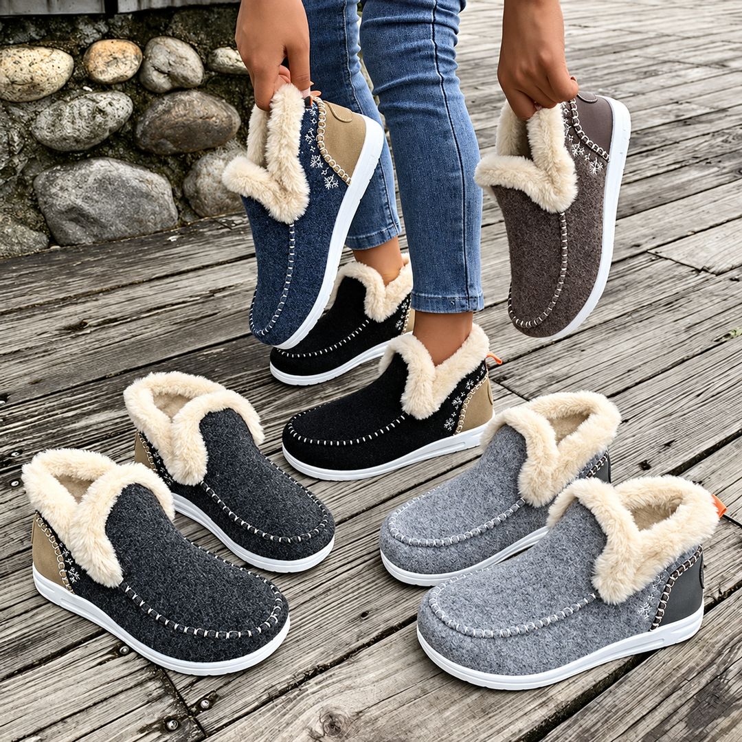 Group of slip-on sneakers in navy, brown, black, dark gray and light gray arranged on wooden boards 6