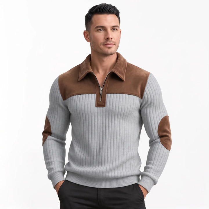 Man wearing the light gray ribbed pullover with brown collar, shoulder panels and elbow patches, looking aside 11