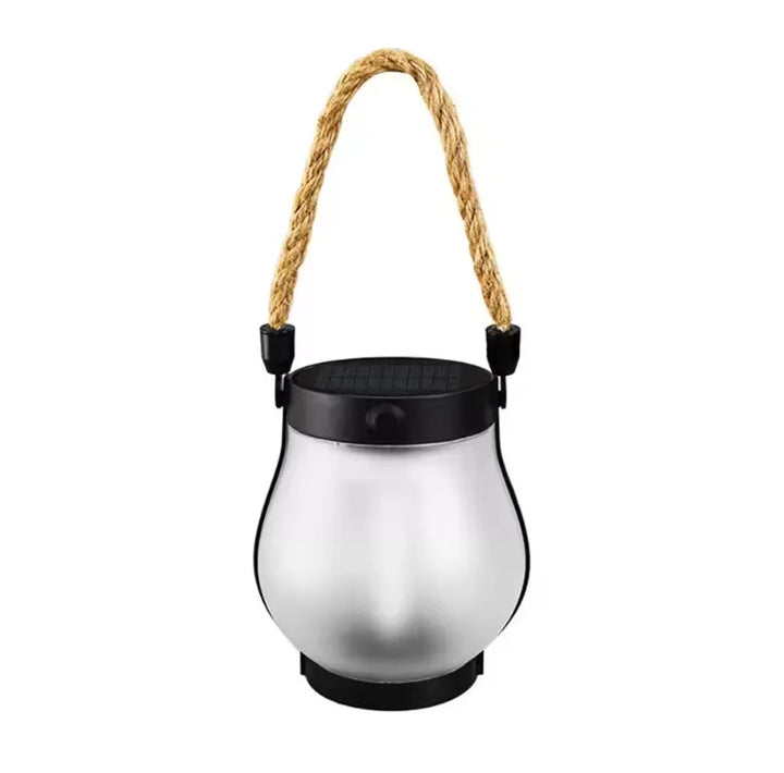 Frosted glass lantern with black solar lid and rope handle, unlit, on a white background 11