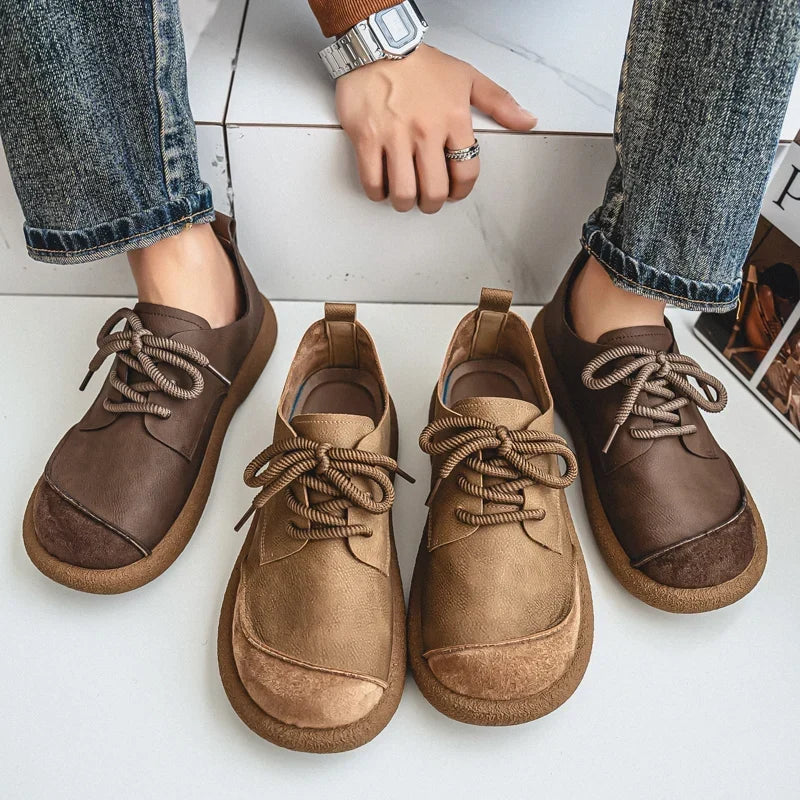 Brown and khaki shoe pairs shown from above next to a seated person in jeans 11