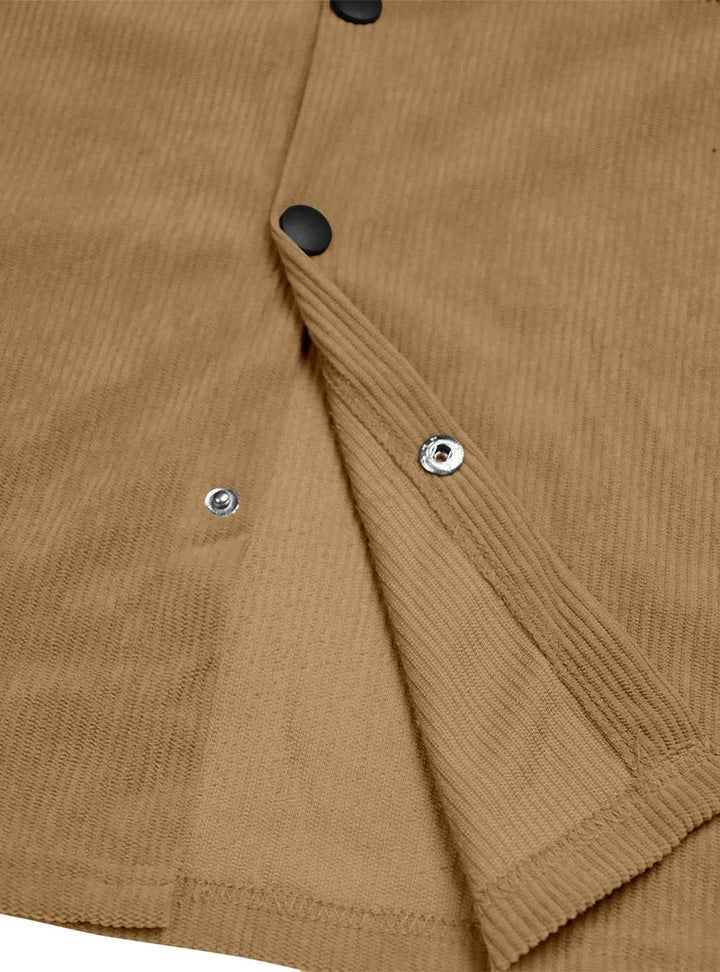 Inside of the tan shirt's front placket showing metal snap fasteners and black snap buttons 11