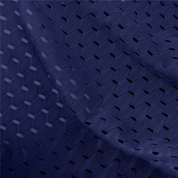Close-up of navy blue perforated mesh fabric, showing the small oval holes in the woven texture 4