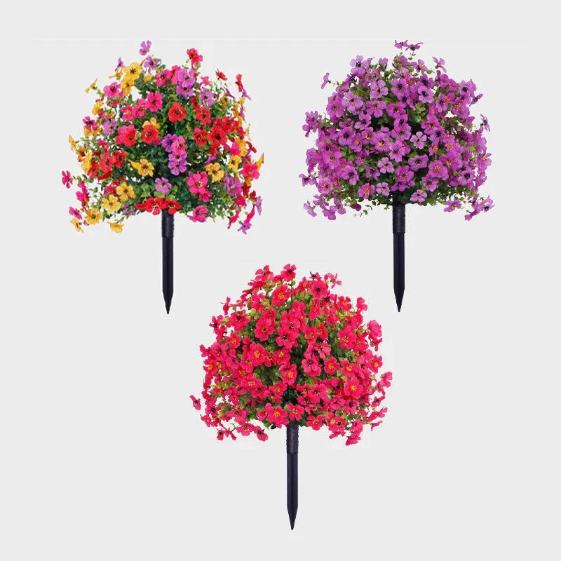 Three artificial flower bushes in multicolor, purple and hot pink.
