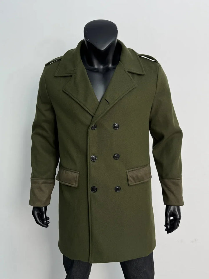 Olive green coat on a mannequin, front view with black buttons and darker suede-look pocket flaps and cuffs 11