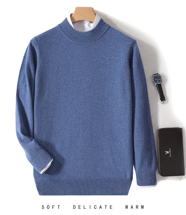 Denim blue knit sweater on a hanger over a white shirt, with a watch and wallet 11