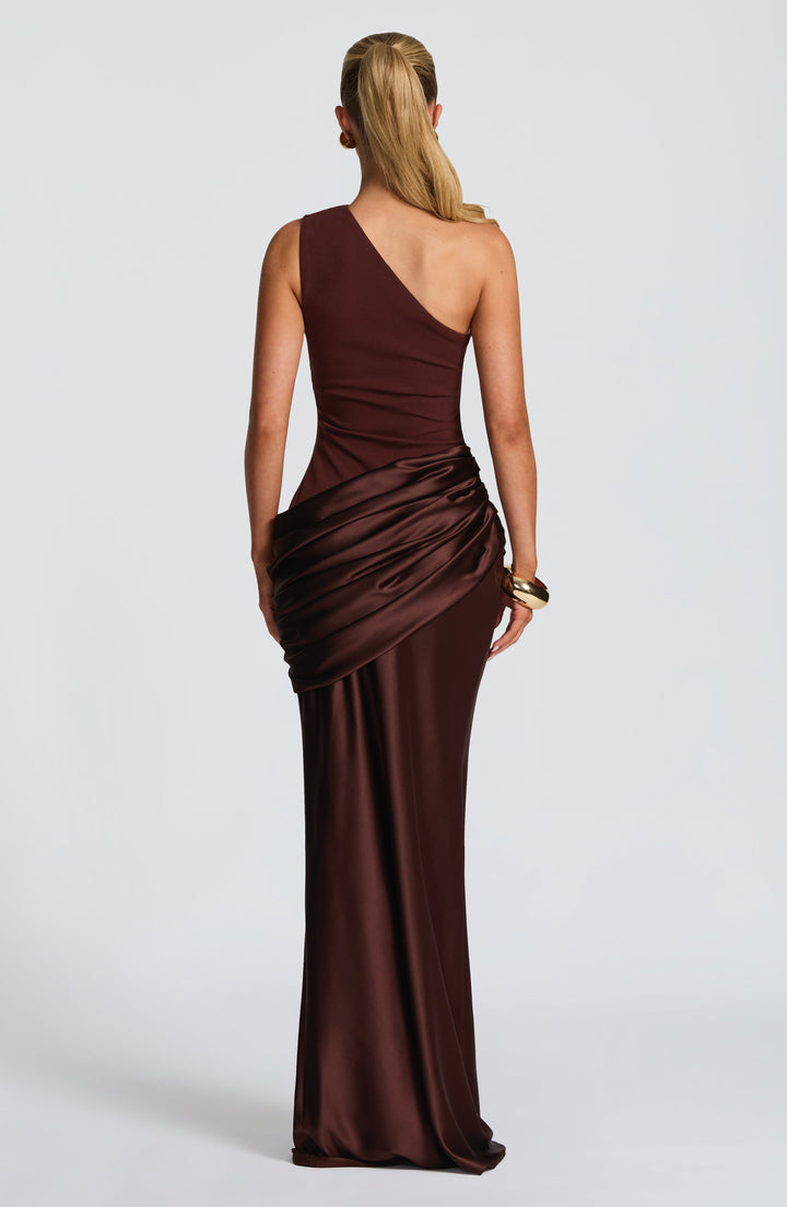 Back view of the brown gown with its asymmetric strap, smooth crepe back and draped satin hip wrap. 9