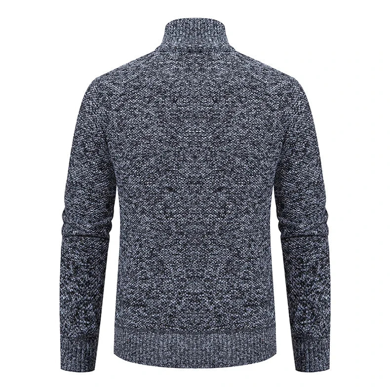 Back view of the dark gray marled cardigan showing the textured knit and ribbed hem 12
