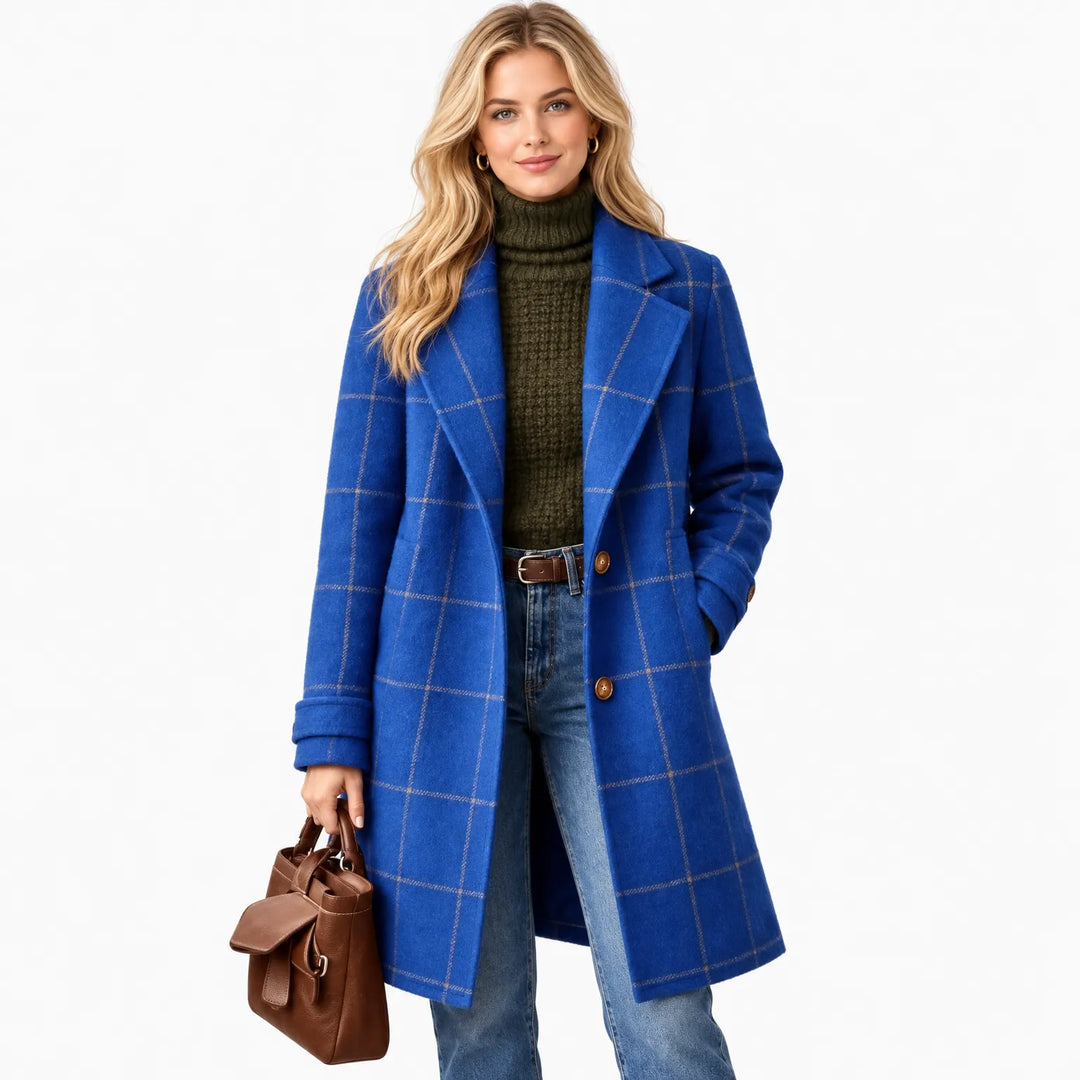 Blonde model in the royal blue checked coat against white, with a brown tote and jeans 12