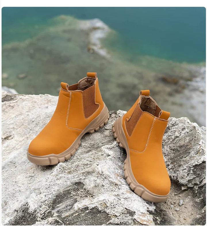 Pair of tan boots resting on a rough rock with a green-blue lake behind 12