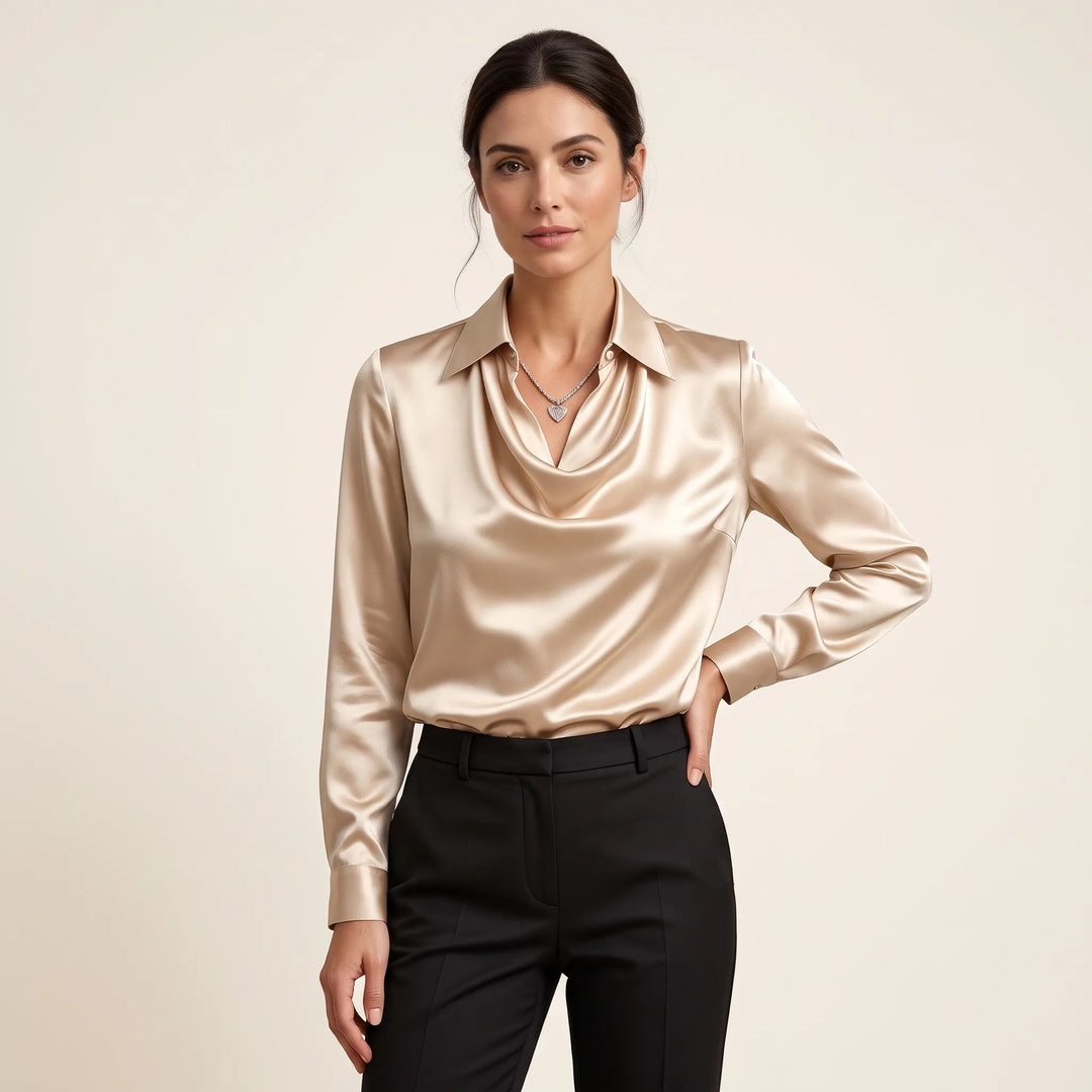 Studio front view of the champagne satin blouse with draped collar, hand on hip, black trousers 12