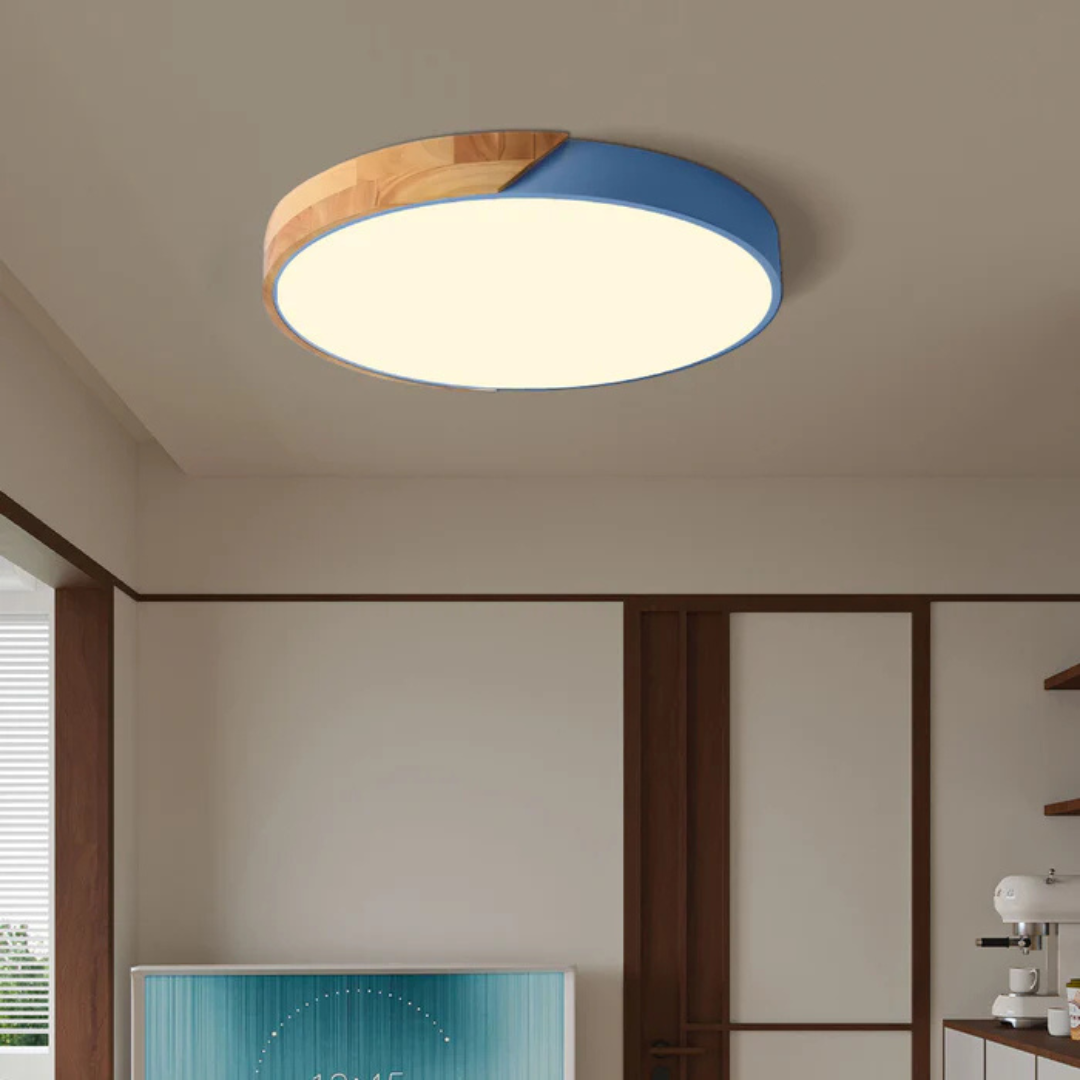 Delos Scandi Wood Ceiling Light in blue and wood trim glowing warm white.