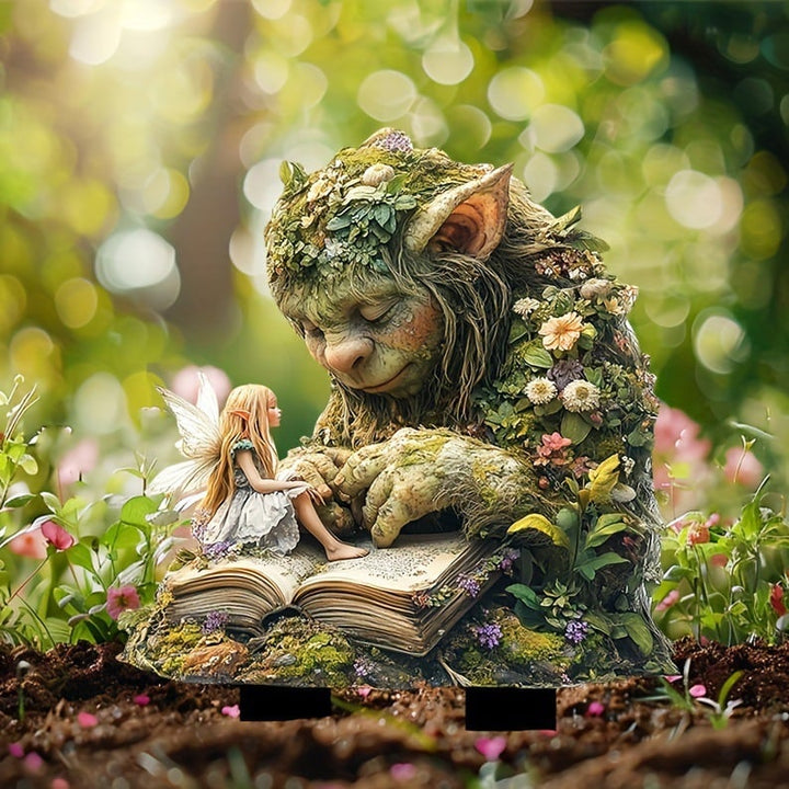 Fairy Tale Acrylic Garden Stake with a troll and fairy on an open book detail