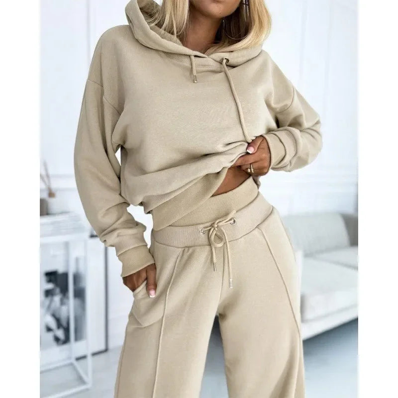 Torso close-up of a beige hoodie with drawstrings and matching ribbed-waist pants with front seam 13