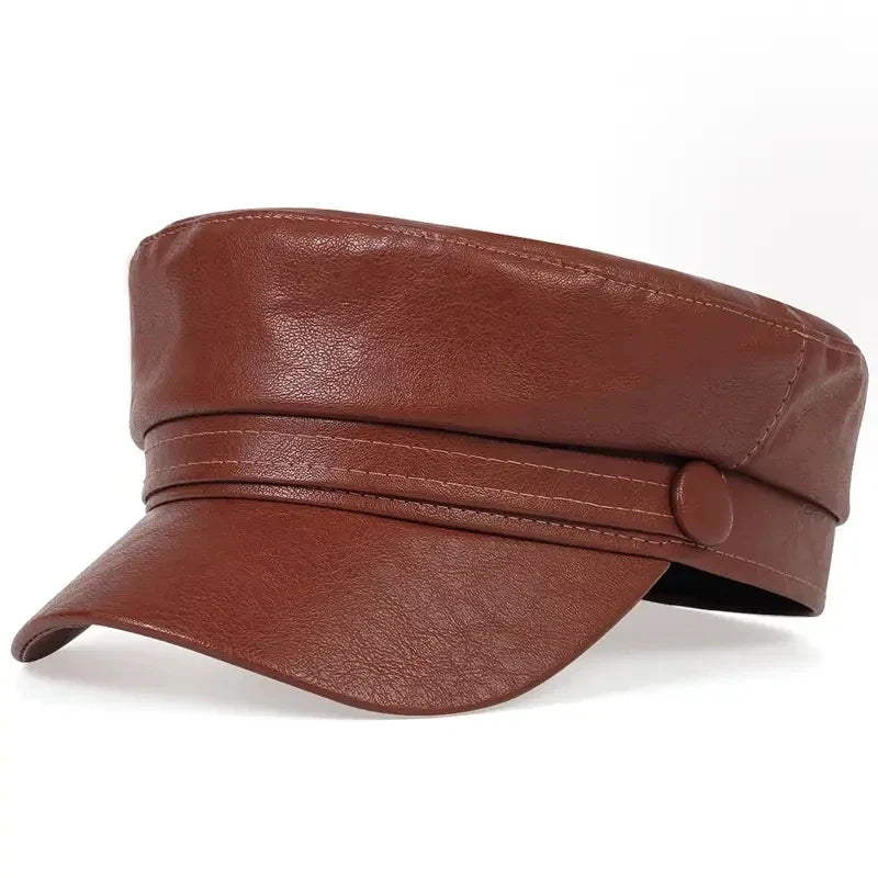 Brown faux leather baker boy cap in angled view with visible light stitching along the band 13