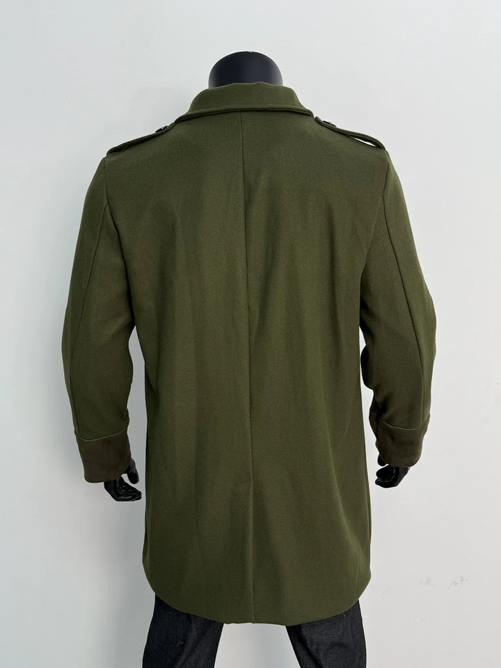 Back view of the olive green coat on a mannequin, showing the center seam, epaulettes and darker cuffs 13
