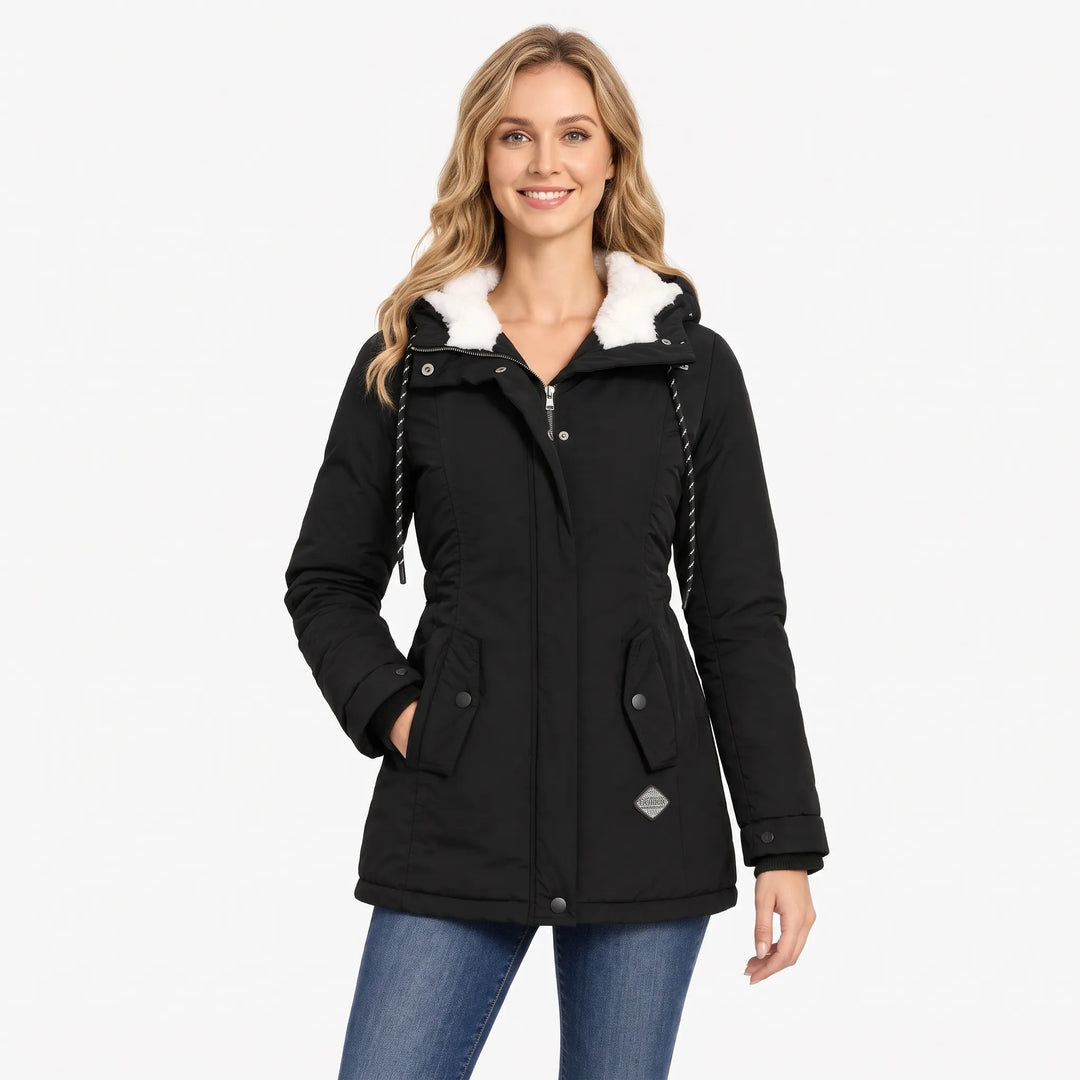 Smiling blonde model in the black jacket and jeans, hood lined in white fleece 13