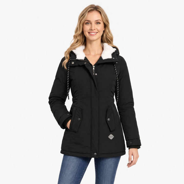 Smiling blonde model in the black jacket and jeans, hood lined in white fleece 13