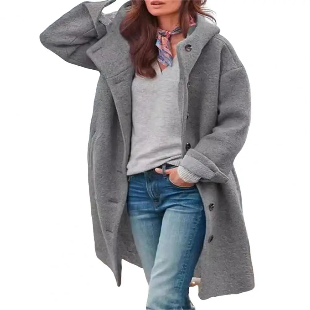 Gray hooded coat worn open over a light gray top and jeans, white background 13