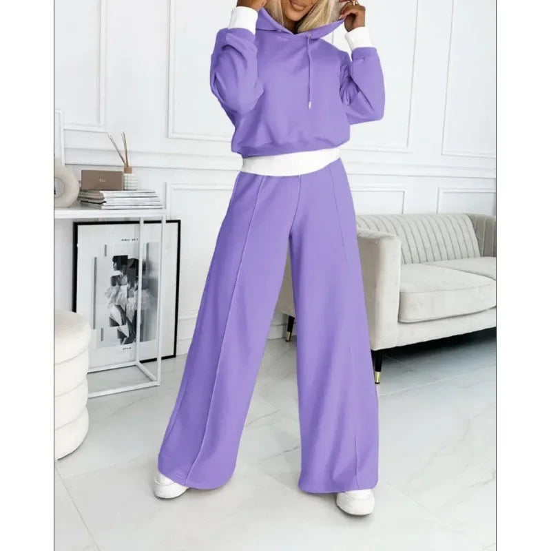 Full-length model in a lavender hoodie and wide-leg pants with white cuffs and trim 14