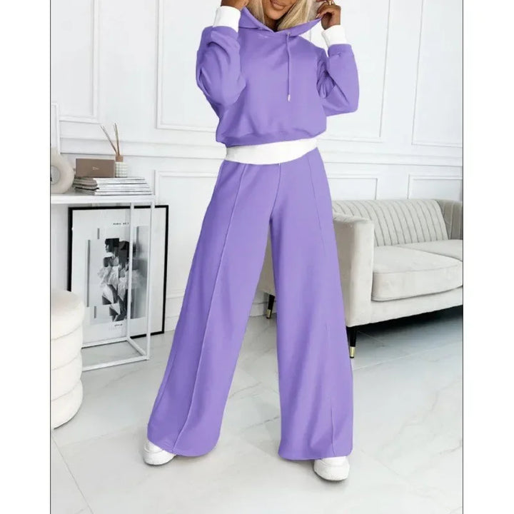 Full-length model in a lavender hoodie and wide-leg pants with white cuffs and trim 14