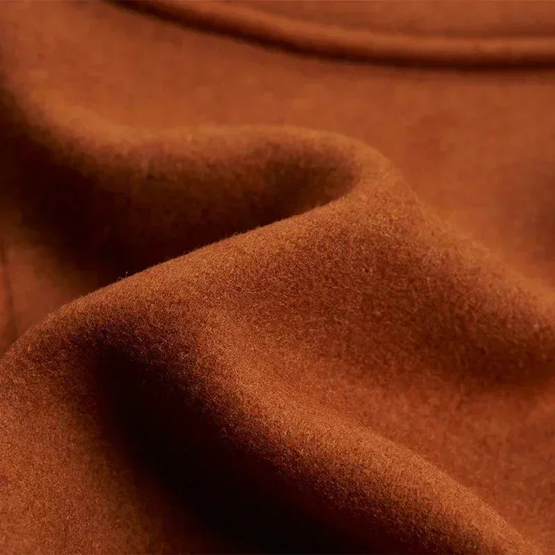 Close-up of the soft, brushed brown wool-blend fabric texture in gentle folds 14