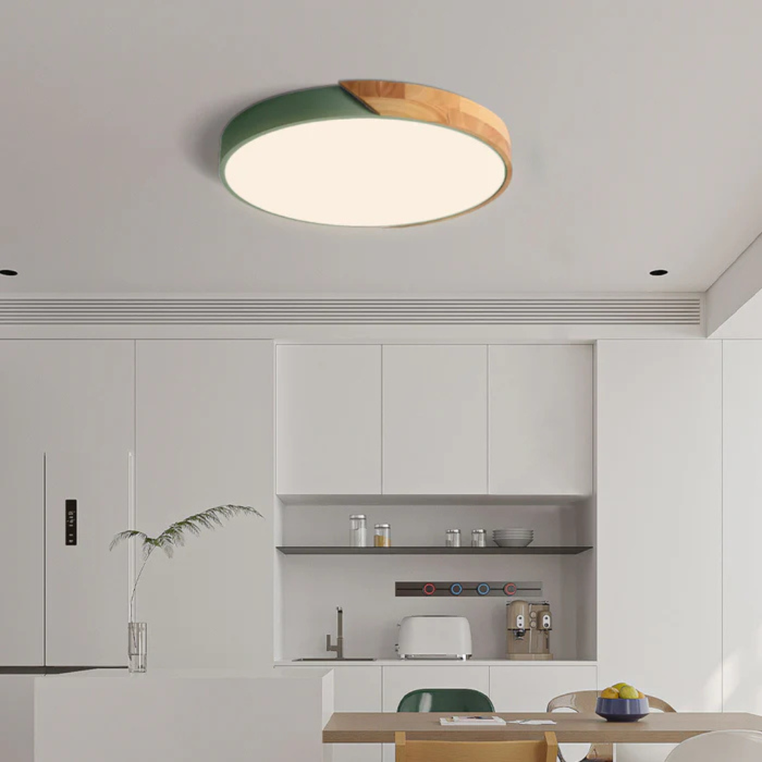 Delos Scandi Wood Ceiling Light in green and wood trim above a minimalist white kitchen.