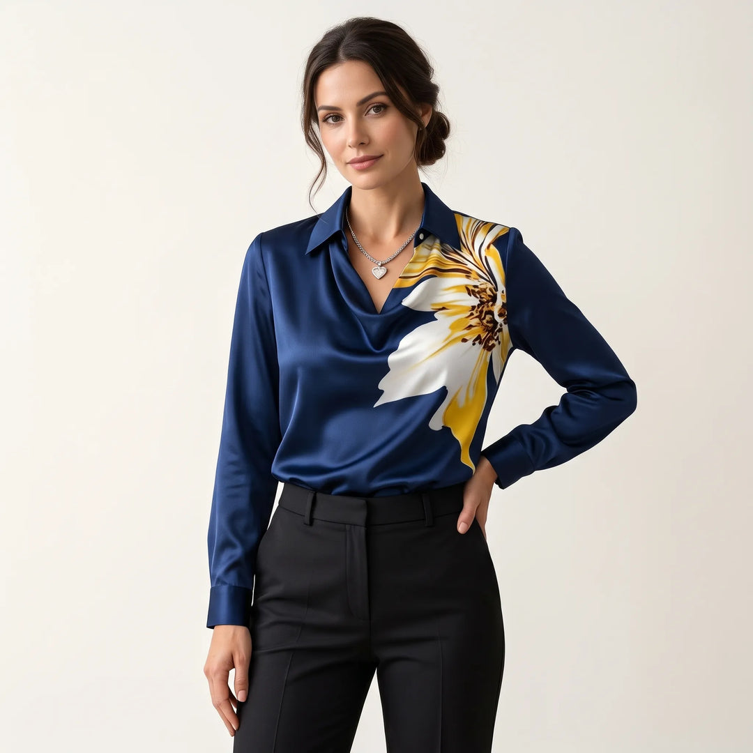 Studio view of the navy satin blouse with large yellow and white flower print on shoulder 14