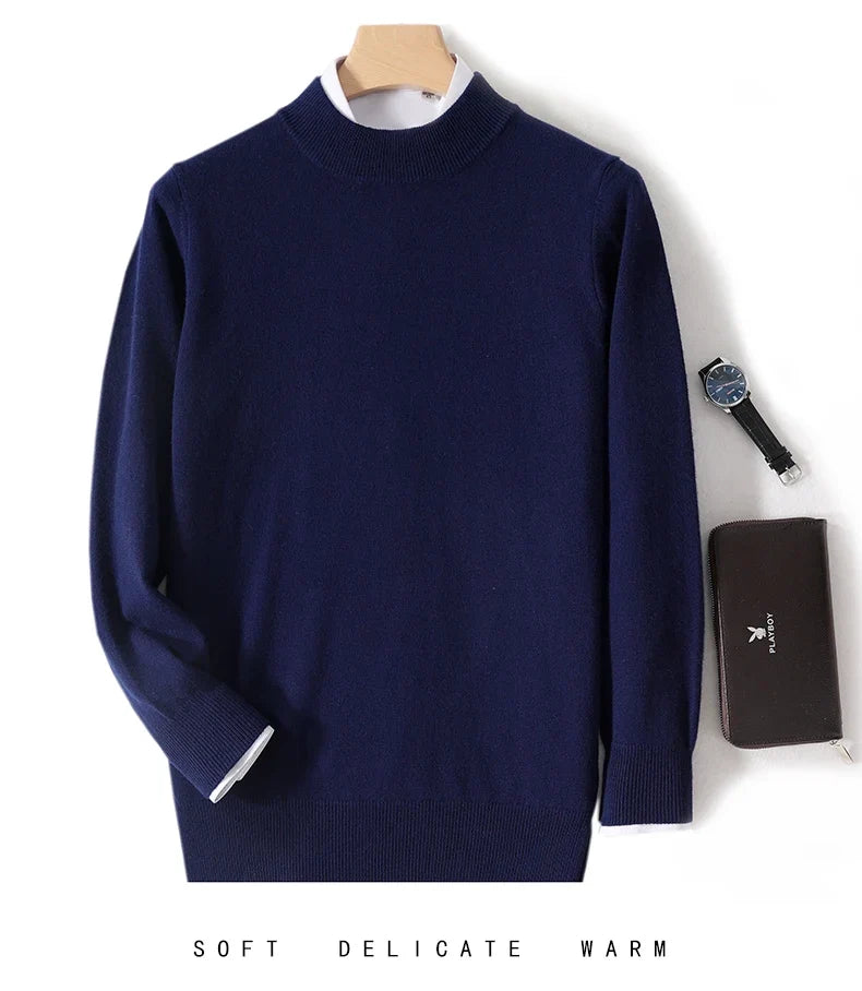 Navy blue knit sweater on a hanger over a white shirt, with a watch and brown wallet 15
