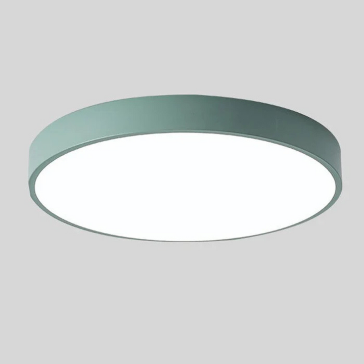 Slim green round ceiling light with a white diffuser, shown from below.