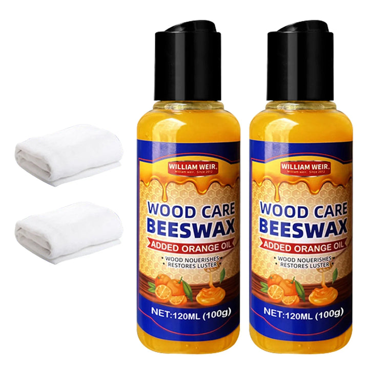 Two polish bottles standing together with two folded white cloths at their left 15