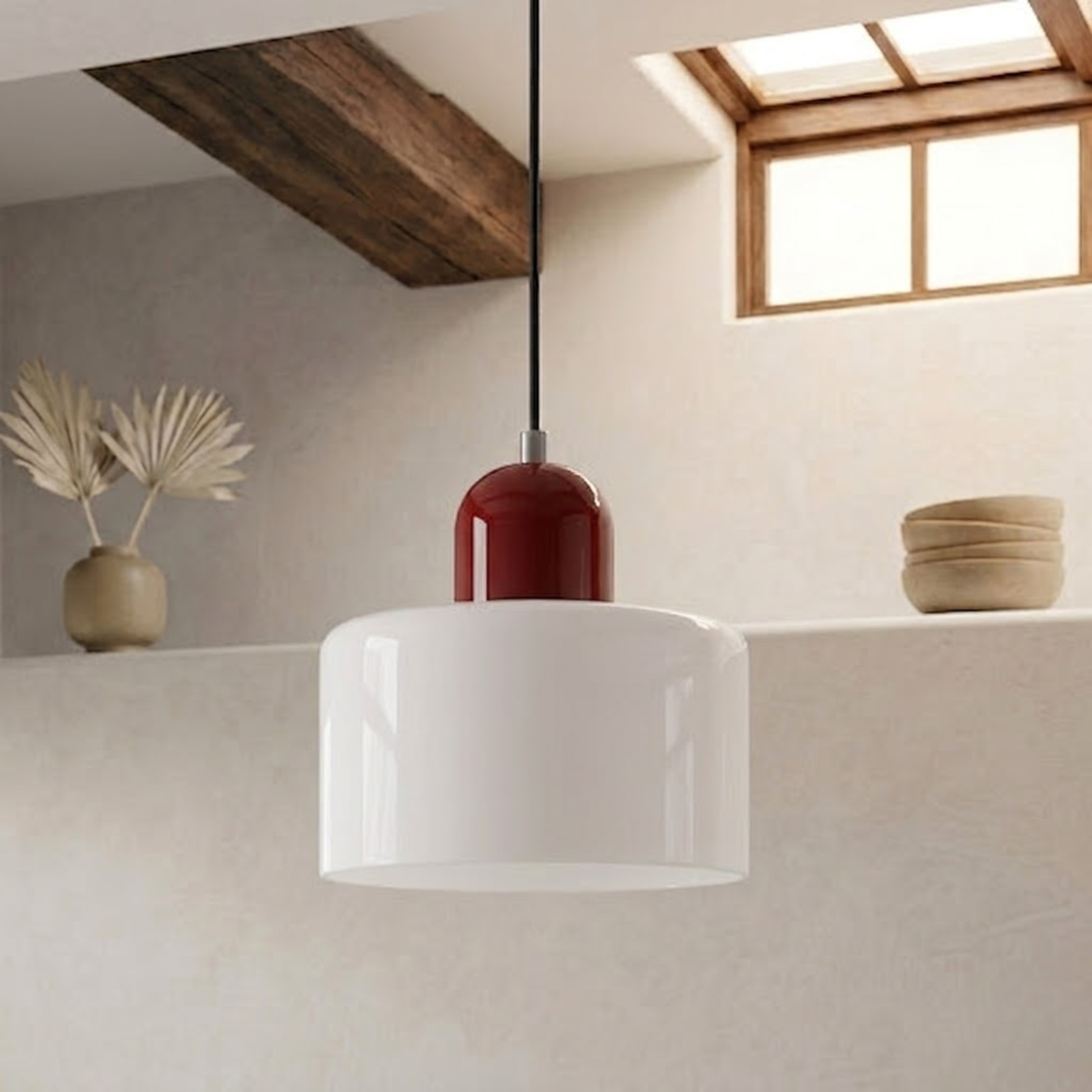 Glossy white drum shade with a dark red dome cap hangs on a black cord in a rustic beamed room. 21