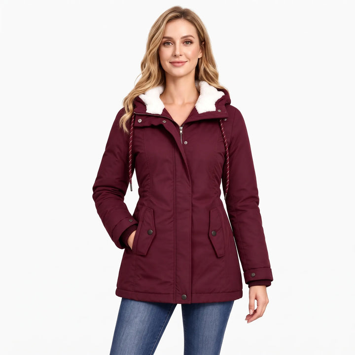 Model wears the burgundy jacket with a white fleece hood lining, burgundy drawcords and jeans 15