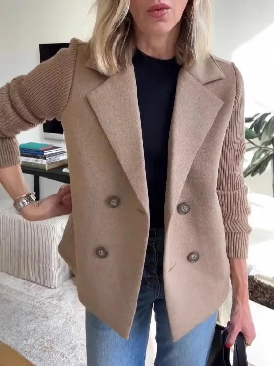 Tan-brown jacket with ribbed knit sleeves and four buttons, worn with jeans, hand on hip 15